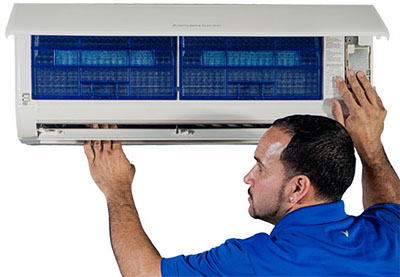 tech checking ductless air conditioner