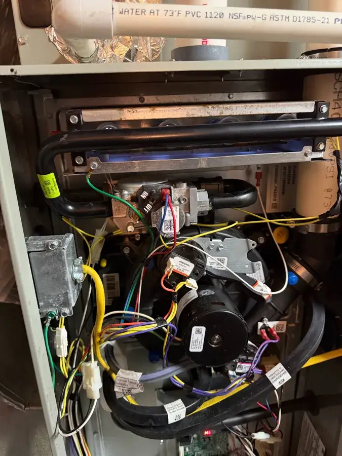 Clean furnace burners lit after a no-heat repair in York, PA